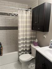 1327 Liverpool Street, Unit 1 Pittsburgh, PA 15233 - Photo 22 of 24 a bathroom with a sink a toilet and shower