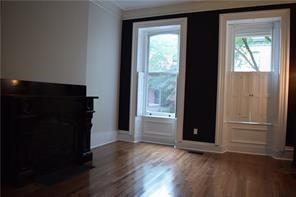 1327 Liverpool Street, Unit 1 Pittsburgh, PA 15233 - Photo 6 of 24 an empty room with wooden floor and windows