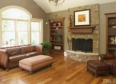 Kitchen open to family room/hearth room with stone fireplace and distressed cherry cabinetry Other