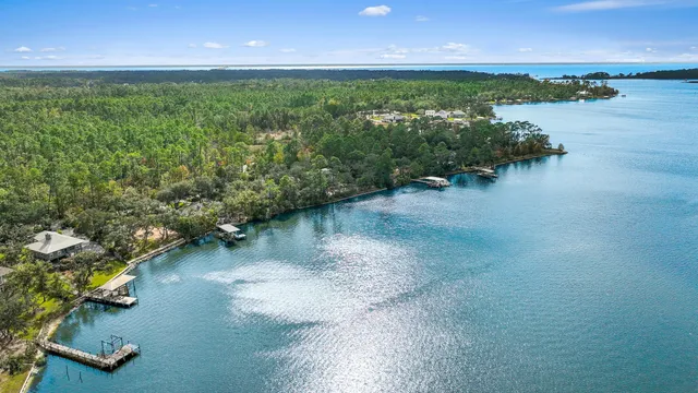 a view of a lake with houses in the back