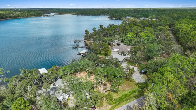 an aerial view of a houses with yard