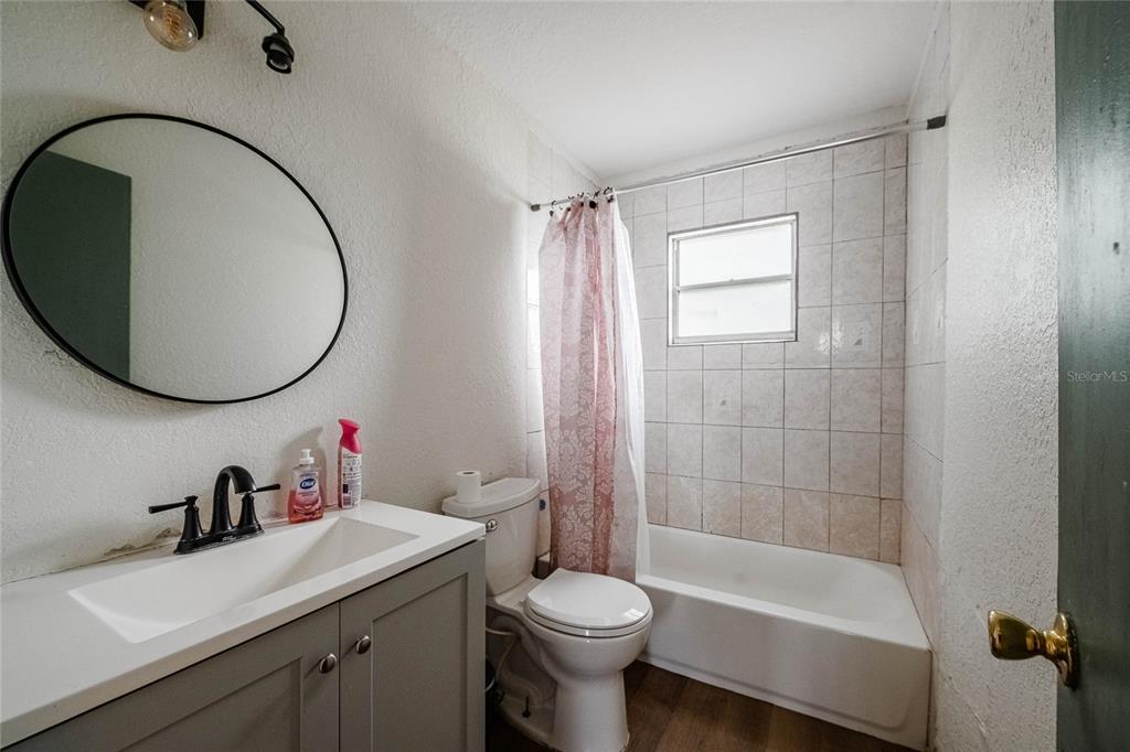 5 North Street Frostproof, FL 33843 - Photo 18 of 22 a bathroom with a sink toilet and a mirror