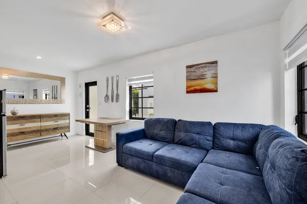 a living room with furniture and a couch