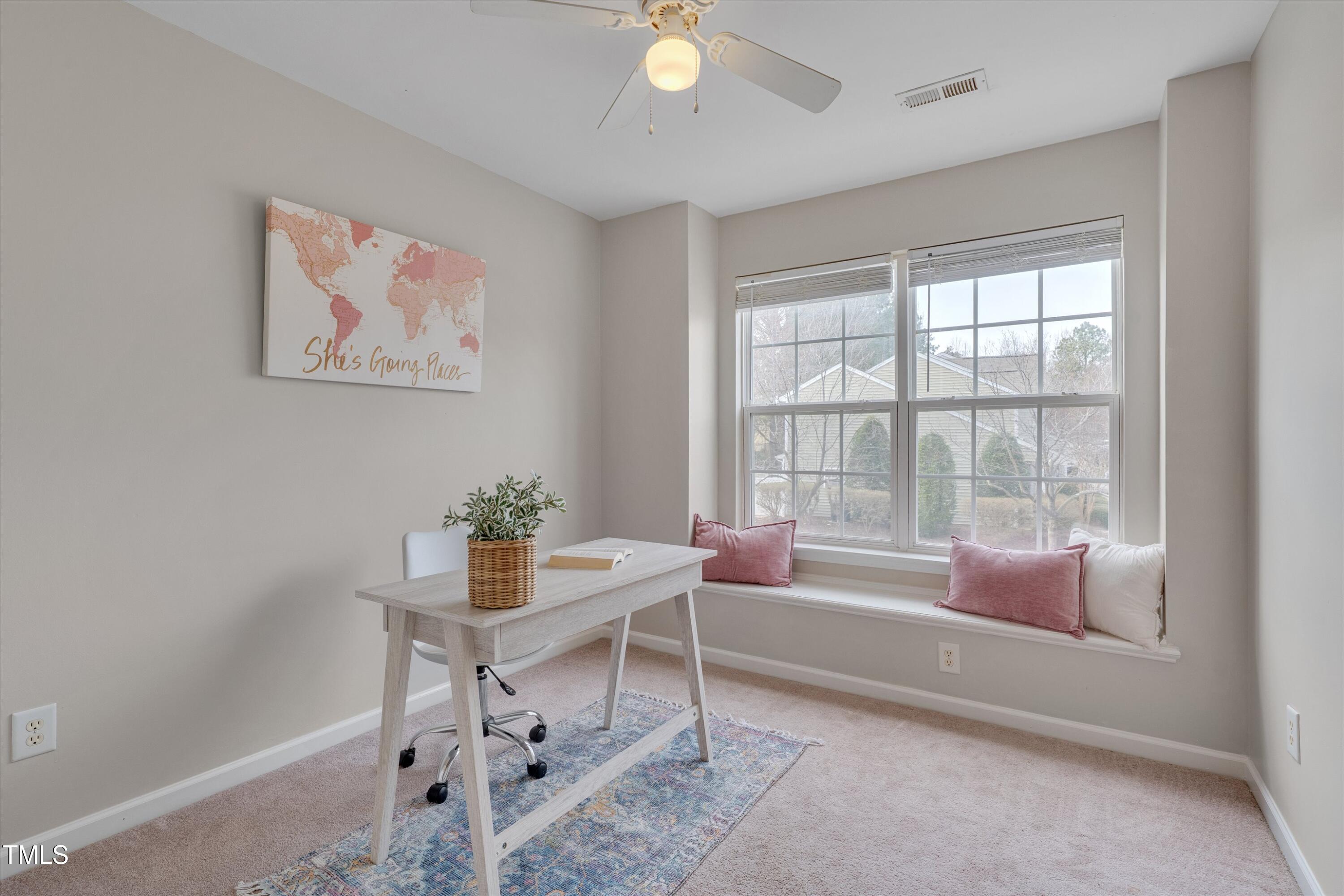 7704 Averette Field Drive Raleigh, NC 27616 - Photo 18 of 25 a living room with furniture and a window