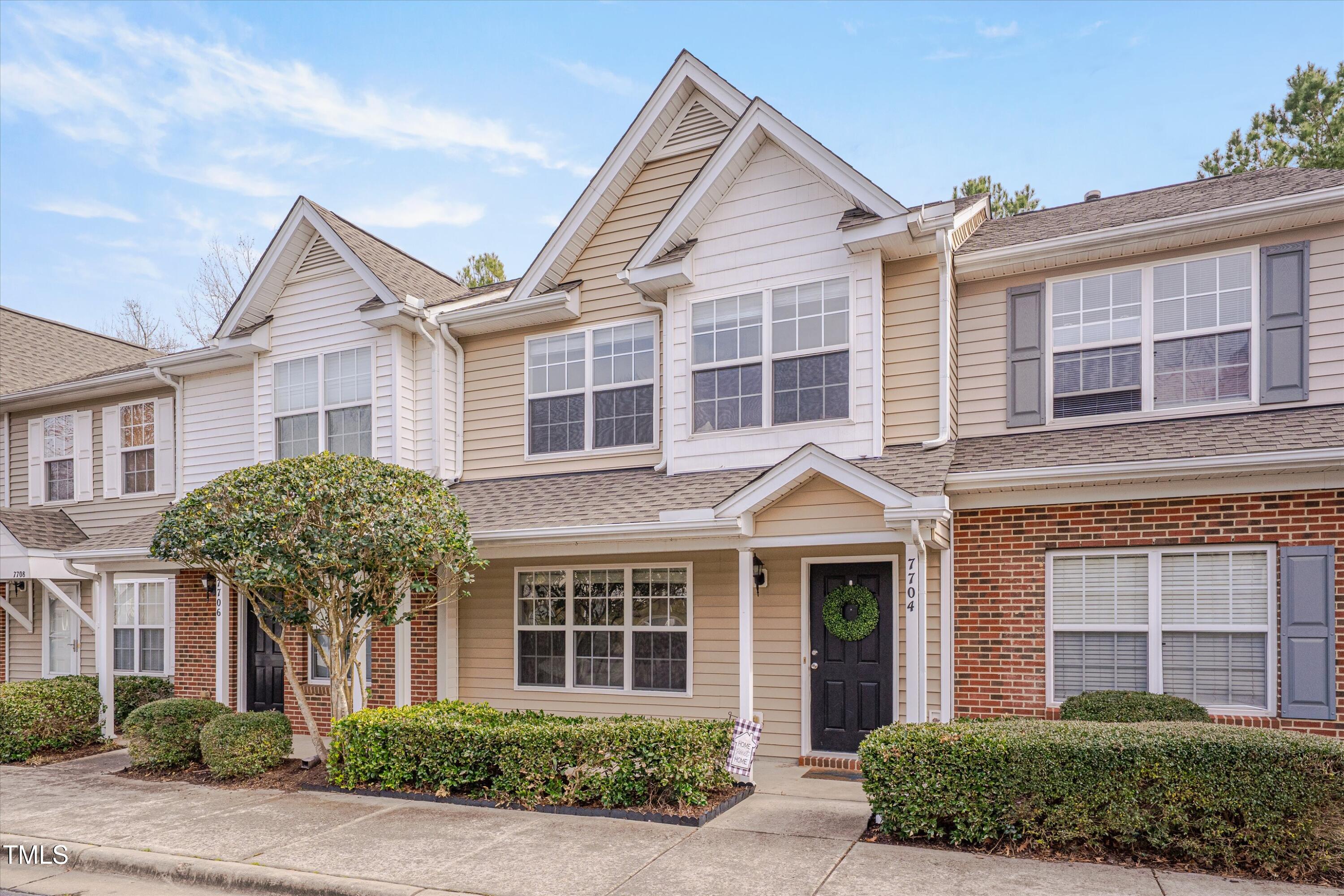 7704 Averette Field Drive Raleigh, NC 27616 - Photo 2 of 25 front view of a brick house with a yard