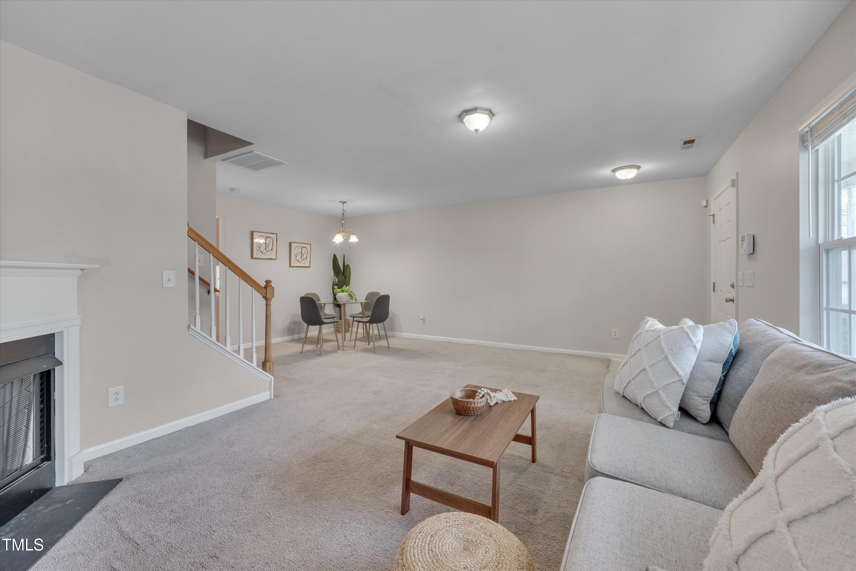 7704 Averette Field Drive Raleigh, NC 27616 - Photo 7 of 25 a living room with furniture
