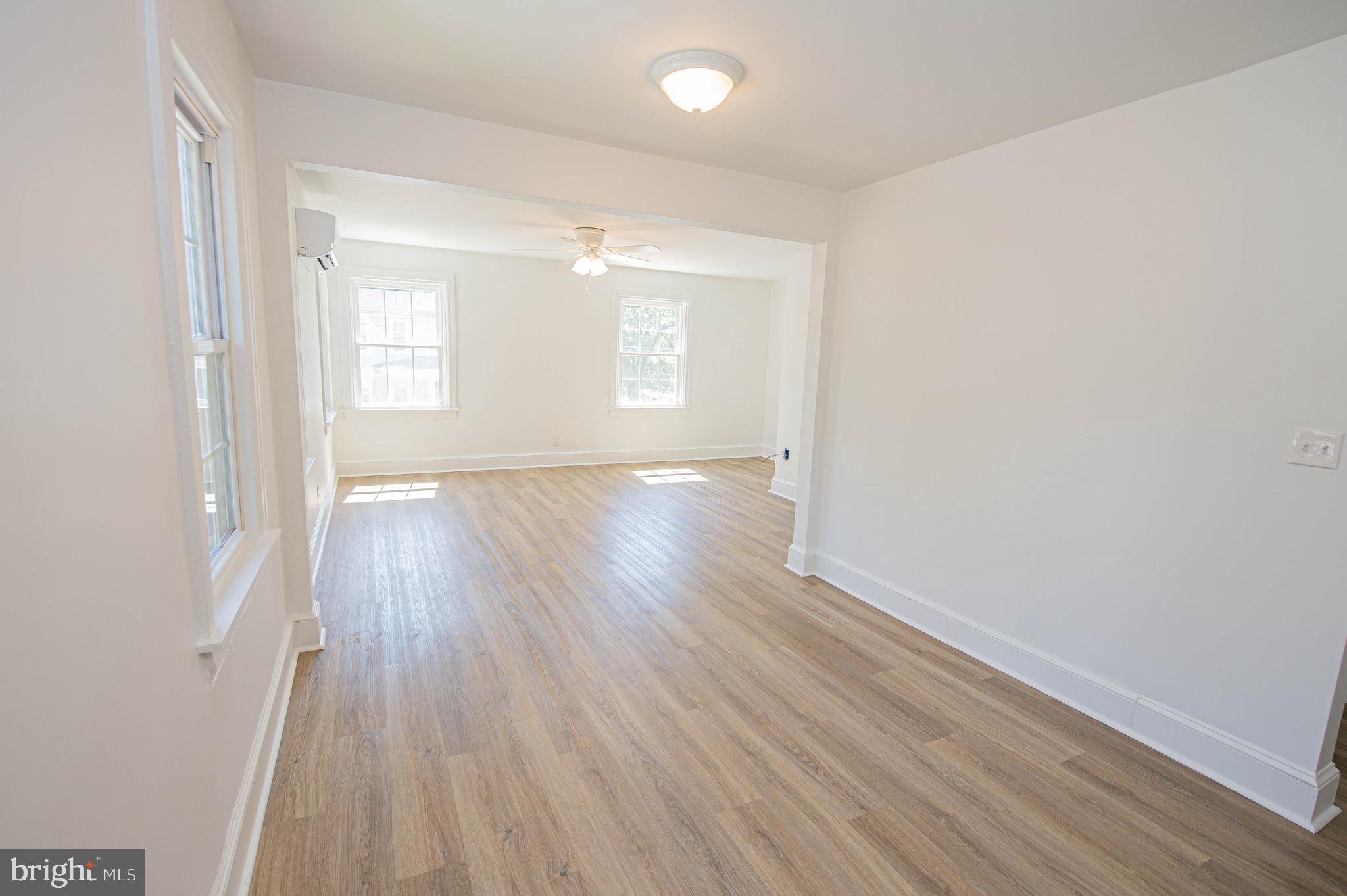 308 North Division Street, Unit 12 Salisbury, MD 21801 - Photo 13 of 42 wooden floor in an empty room with a window