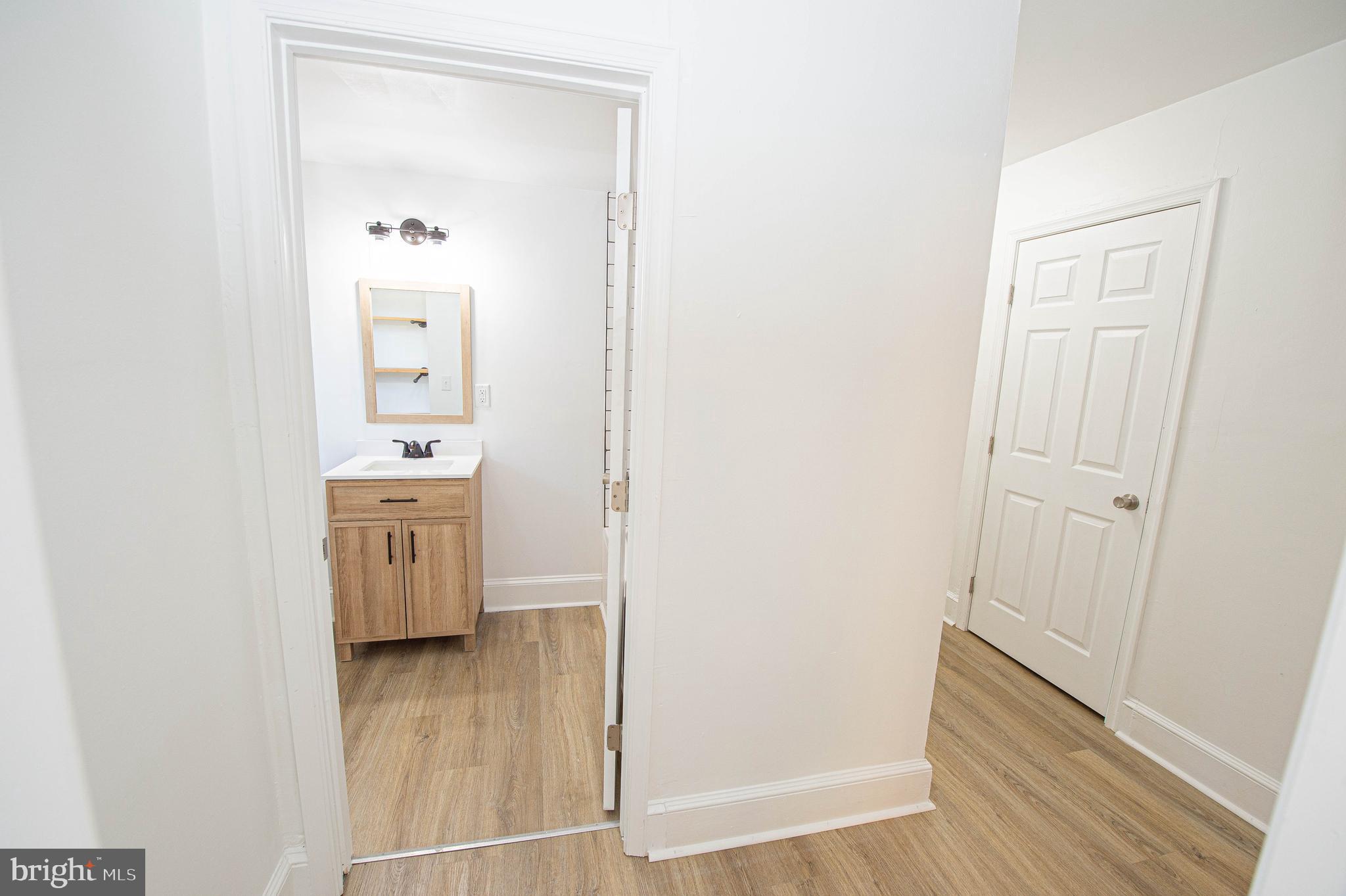 308 North Division Street, Unit 12 Salisbury, MD 21801 - Photo 33 of 42 a view of bathroom with mirror on the wall