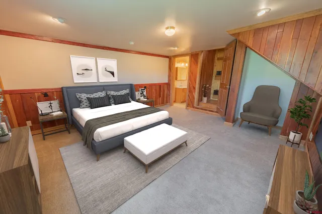 a bedroom with furniture and a large window