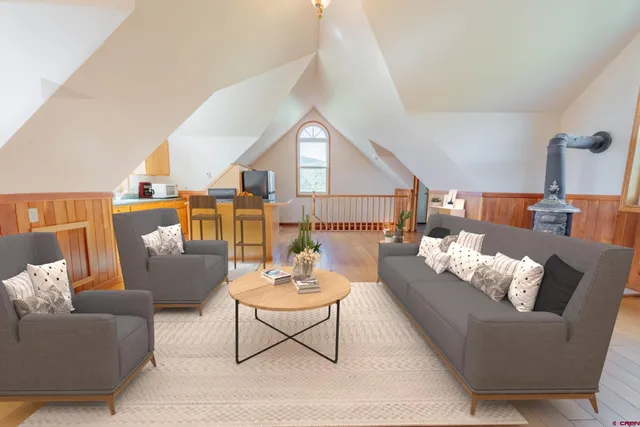 a living room with furniture and a table