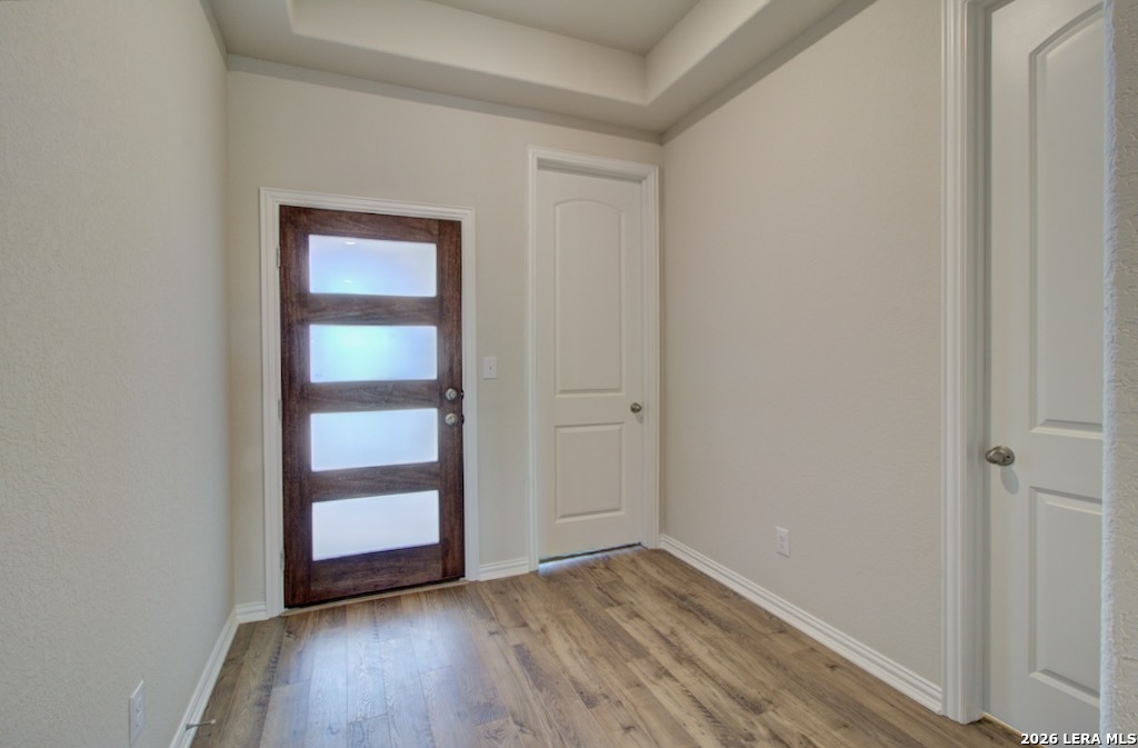 2133 Shepards Street Seguin, TX 78155 - Photo 14 of 21 a view of an empty room with wooden floor and a window