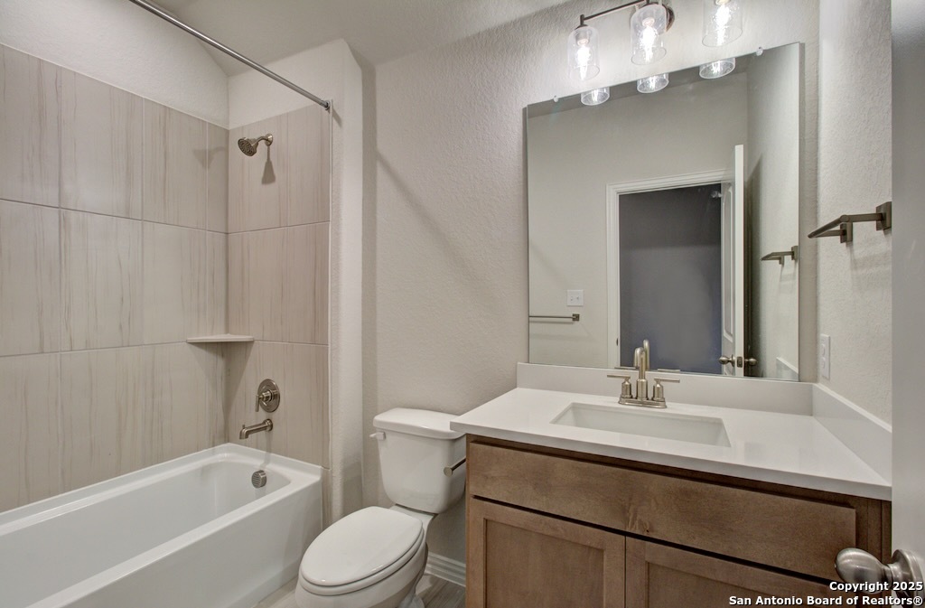 2133 Shepards Street Seguin, TX 78155 - Photo 20 of 22 a bathroom with a sink a toilet and shower