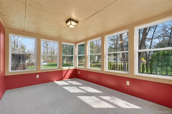 a view of an empty room with a large window