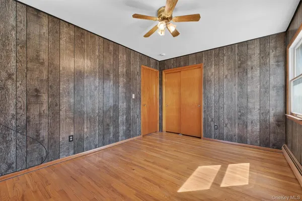 a bed room with a bed and a chandelier