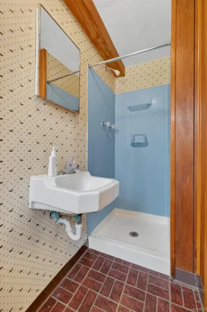 a view of a backyard with wooden fence