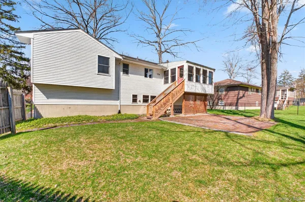 a view of a big yard with a house
