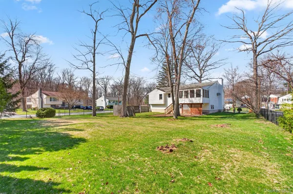 a view of a house with a back yard