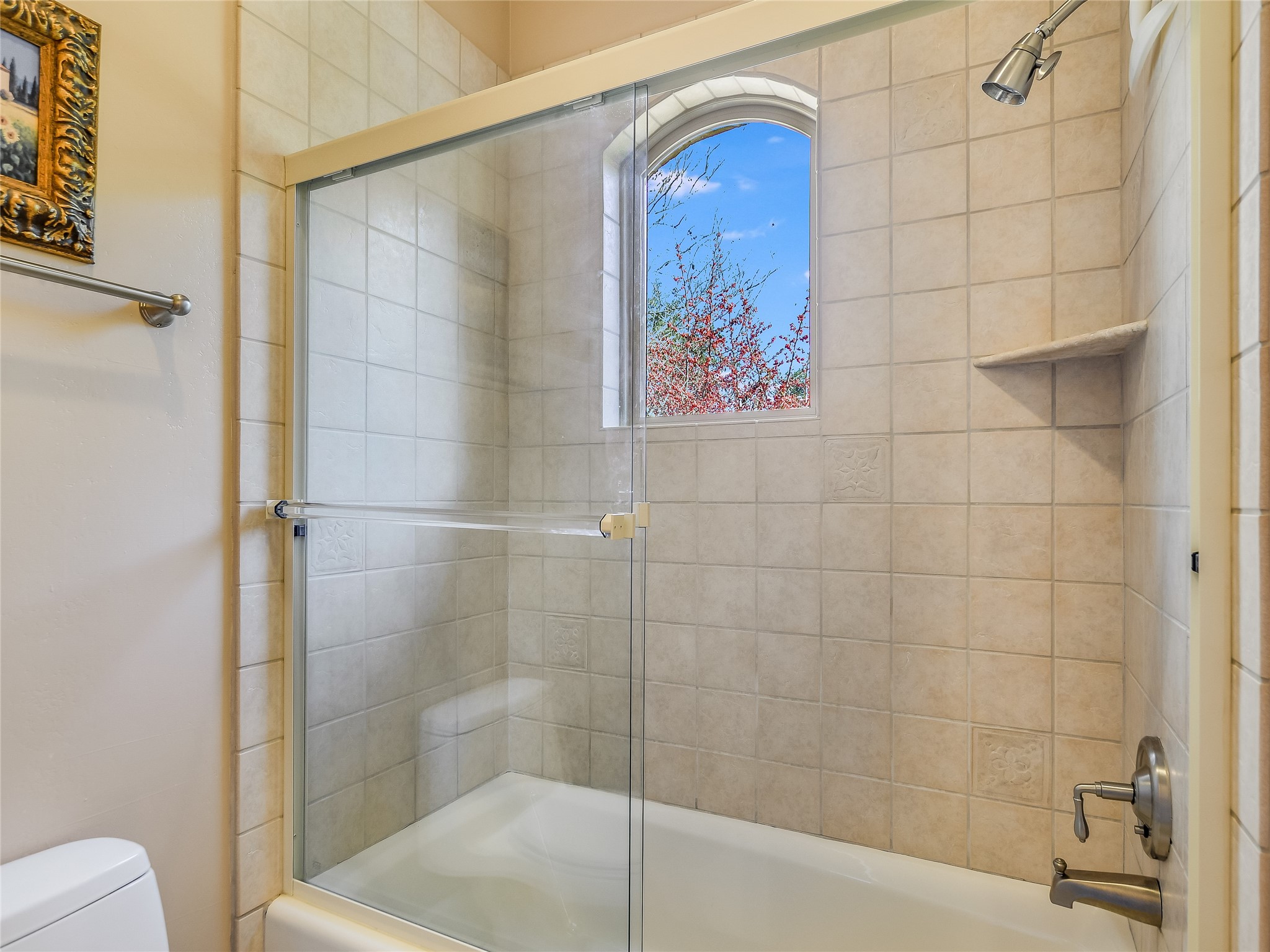 25909 Hamilton Pool Road Round Mountain, TX 78663 - Photo 14 of 34 a bathroom with a bathtub and a shower