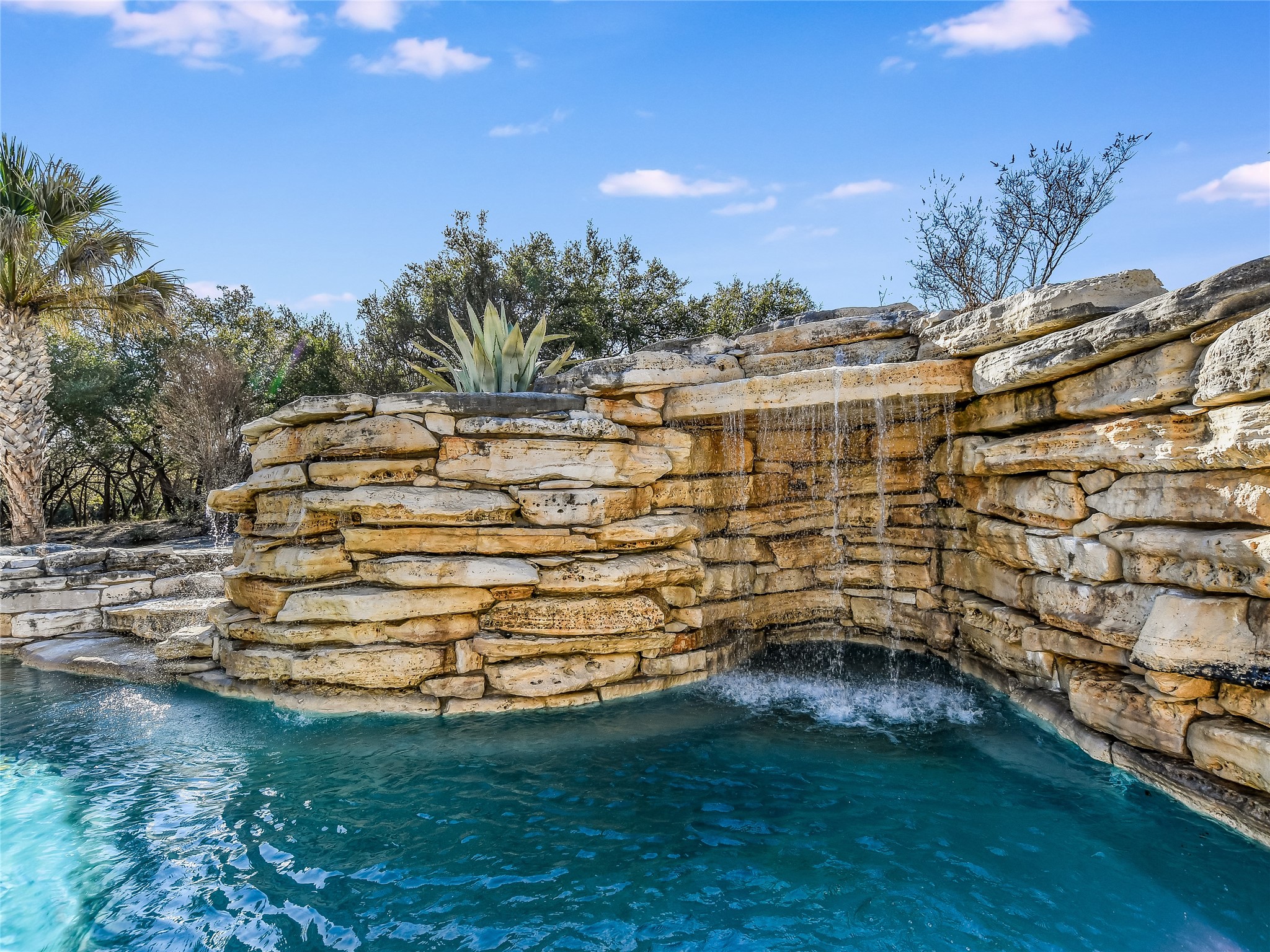 25909 Hamilton Pool Road Round Mountain, TX 78663 - Photo 22 of 34 a view of outdoor space with garden