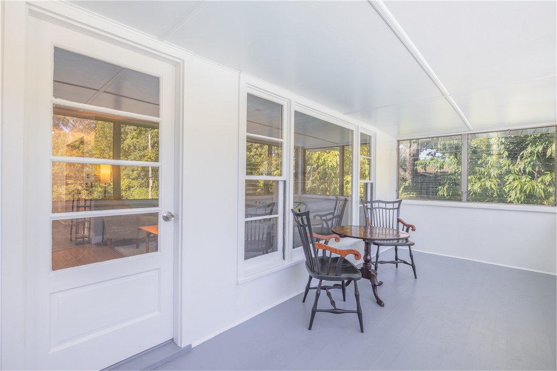 224 Brookview Drive Irondequoit, NY 14617 - Photo 15 of 46 SPACIOUS ENCLOSED PORCH OVERLOOKING POOL AND WOOD