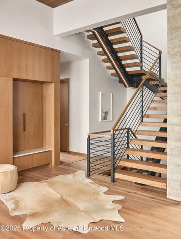 a dining room with a table and chairs