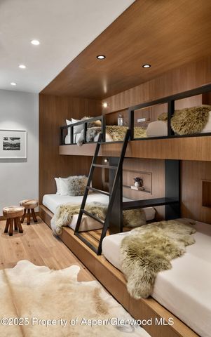 a bedroom with a bed and mirror