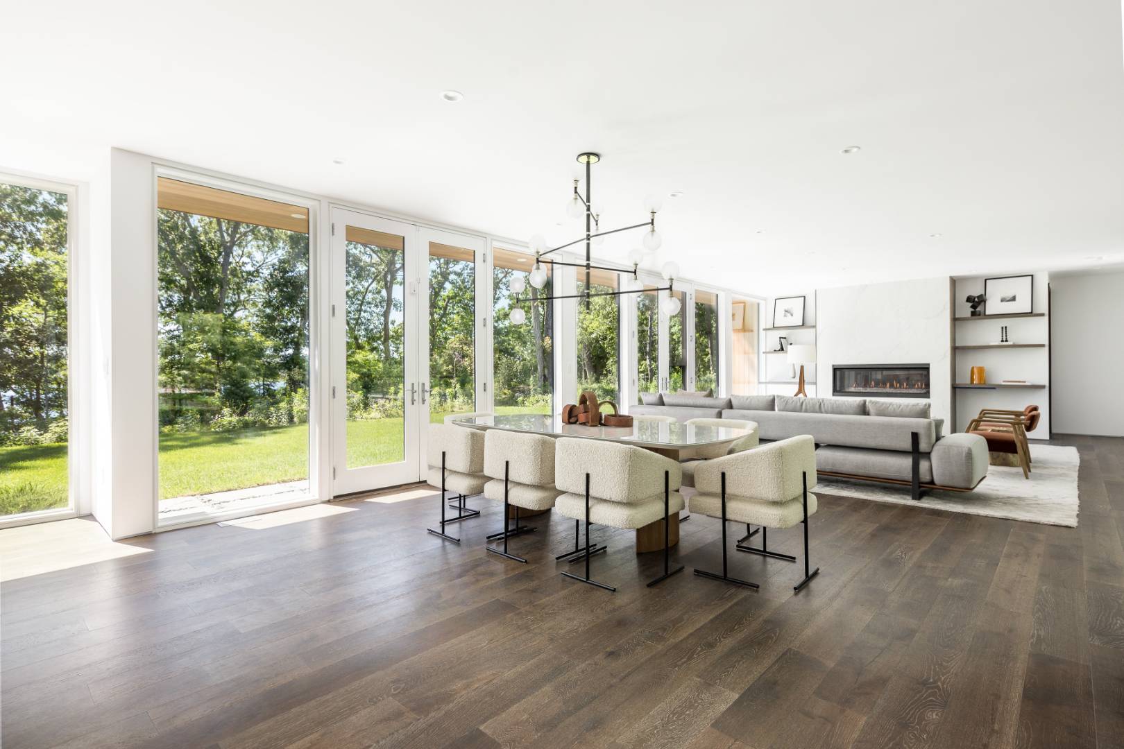 309 Noyack Road Southampton, NY 11968 - Photo 4 of 26 a living room with furniture and large windows