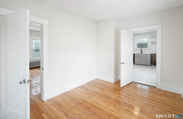 a view of livingroom with hardwood floor and a ceiling fan