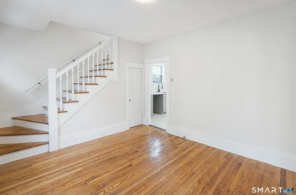a view of entryway with wooden floor
