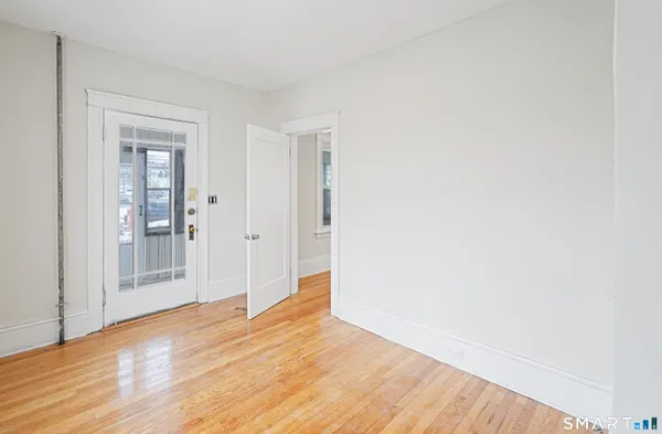 a view of wooden floor in an empty room