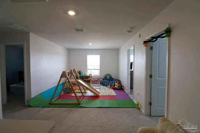 a room with a bed and a chandelier