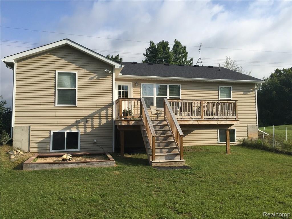 7093 West Allen Road Fowlerville, MI 48836 - Photo 22 of 23 Rear view...more play space...nicest sand box I've seen in awhile!