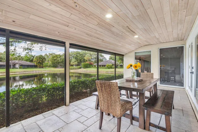 a view of a patio with a table chairs and a table