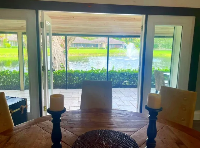 a view of a living room with furniture and a window