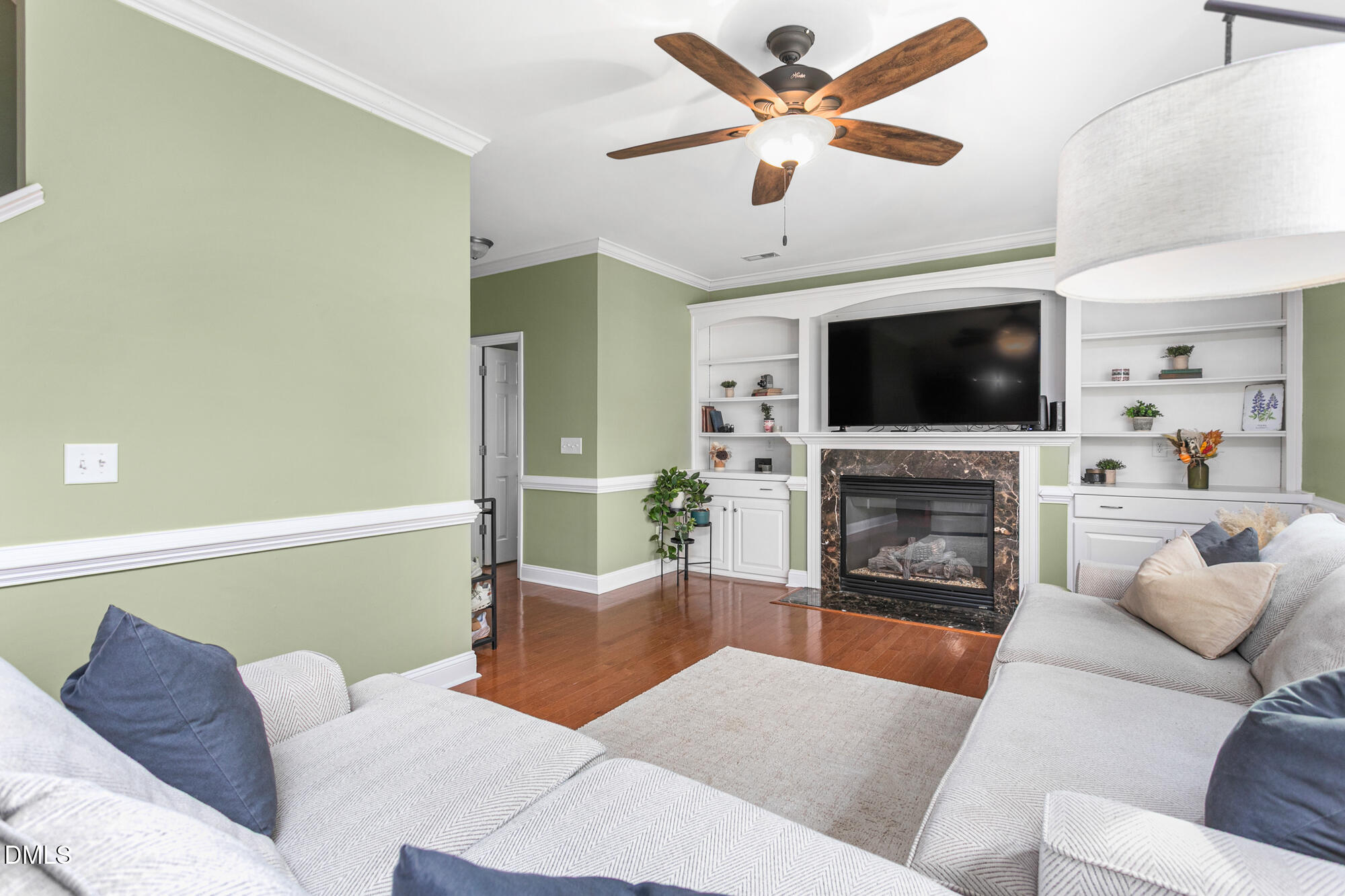 304 Green Pasture Road Mebane, NC 27302 - Photo 13 of 35 a living room with furniture a fireplace and a flat screen tv