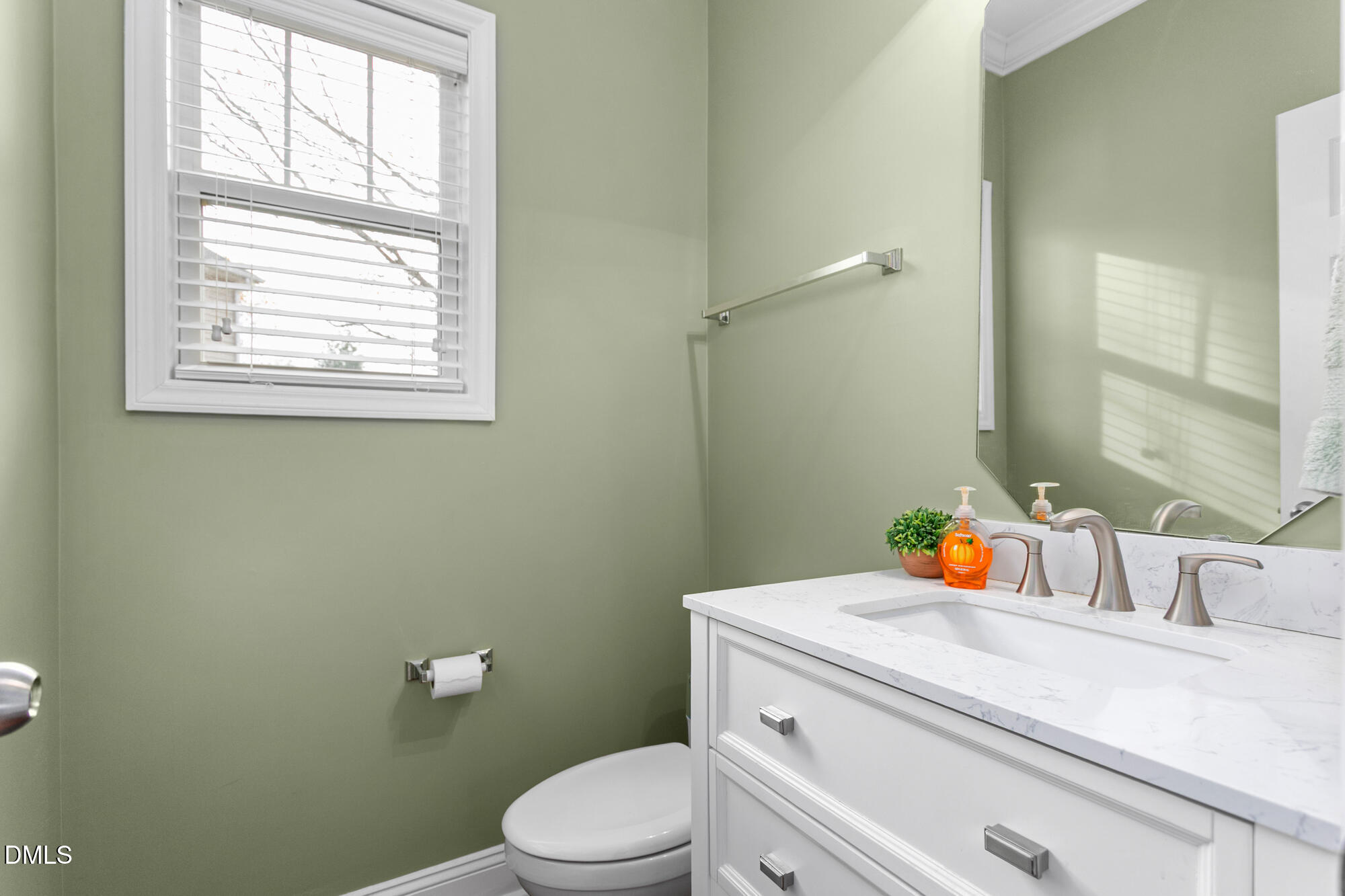 304 Green Pasture Road Mebane, NC 27302 - Photo 16 of 35 a bathroom with a sink a vanity and a window
