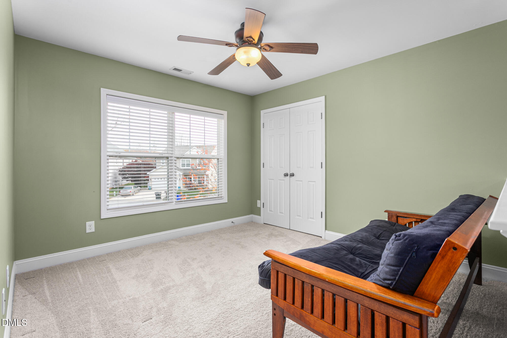 304 Green Pasture Road Mebane, NC 27302 - Photo 19 of 35 a bedroom with a bed and a chandelier