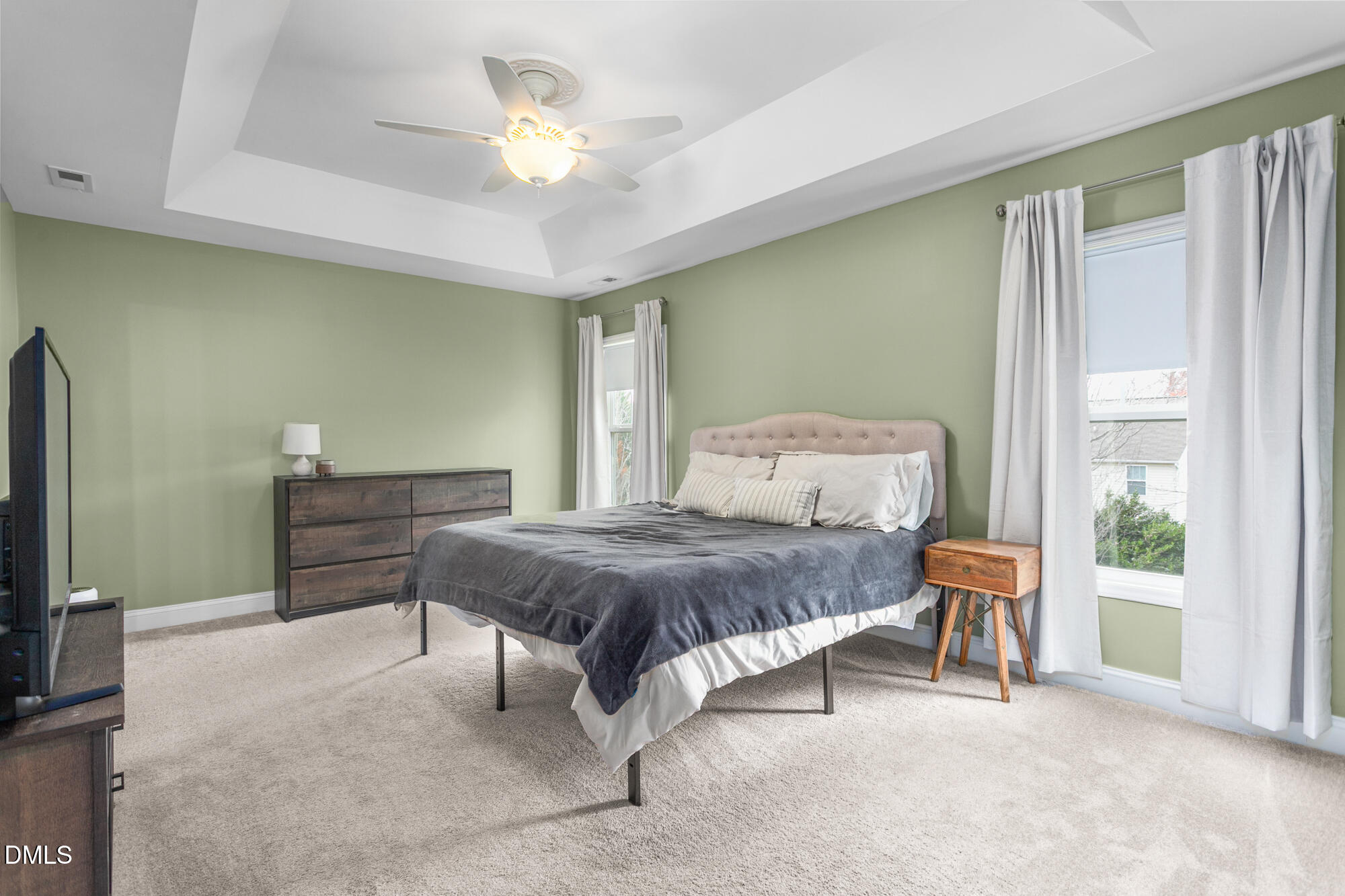 304 Green Pasture Road Mebane, NC 27302 - Photo 20 of 35 a bedroom with a bed and a chandelier
