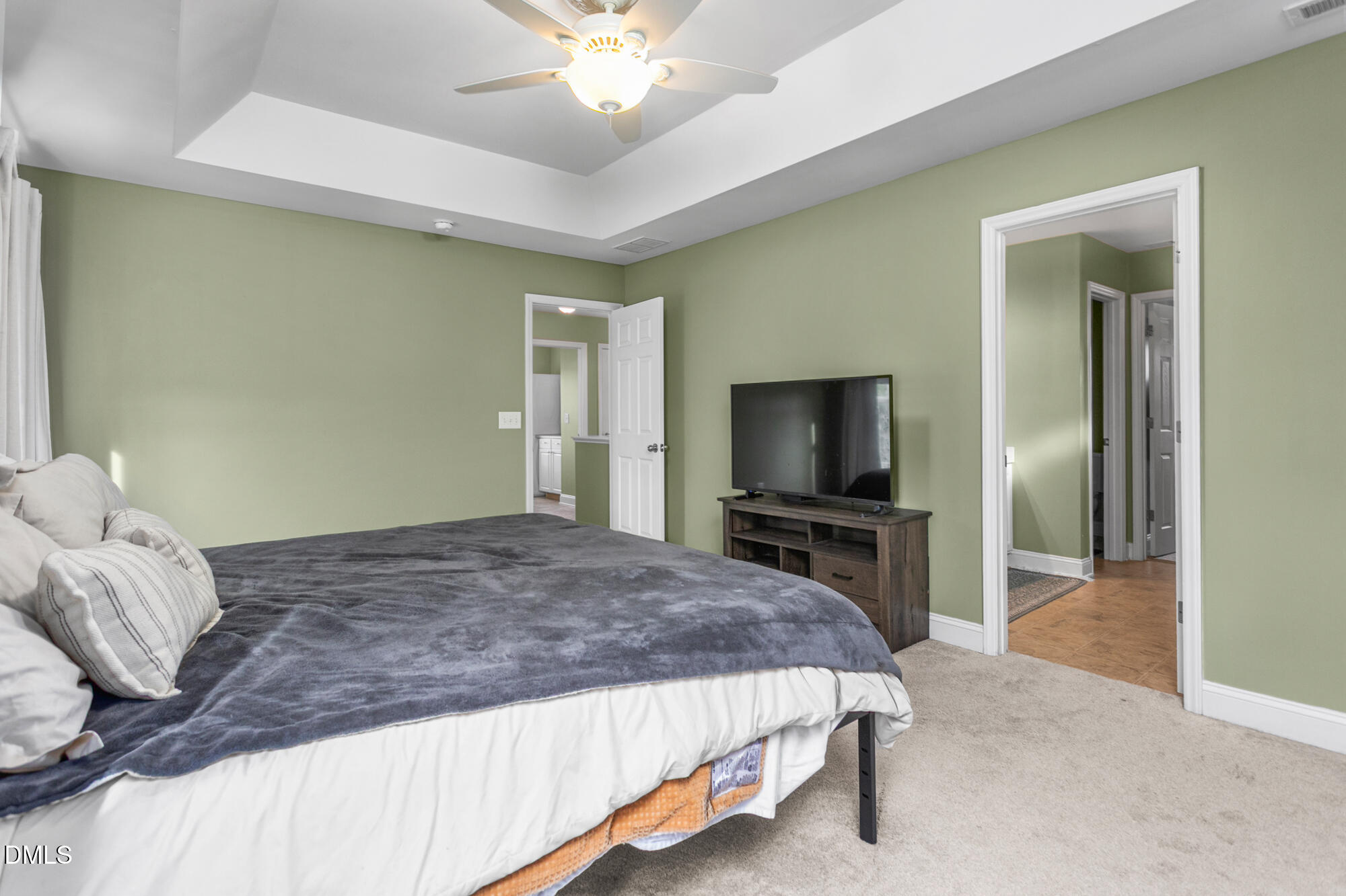 304 Green Pasture Road Mebane, NC 27302 - Photo 22 of 35 a bedroom with a bed and a flat screen tv