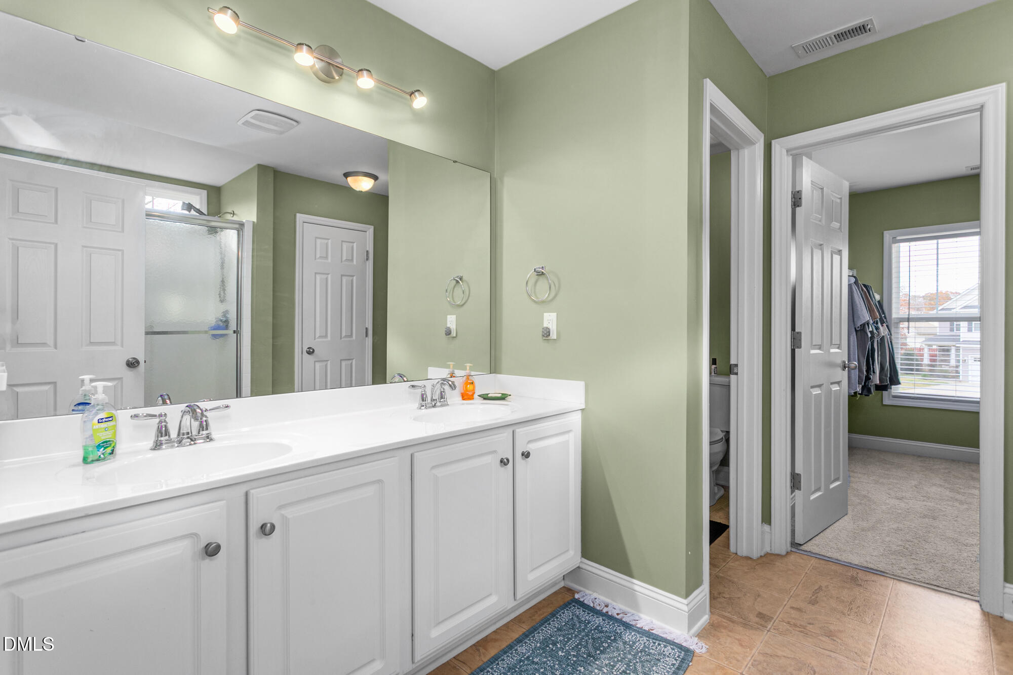 304 Green Pasture Road Mebane, NC 27302 - Photo 23 of 35 a bathroom with a sink double vanity and a mirror
