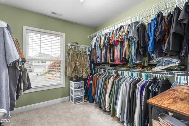 an empty room with closet area