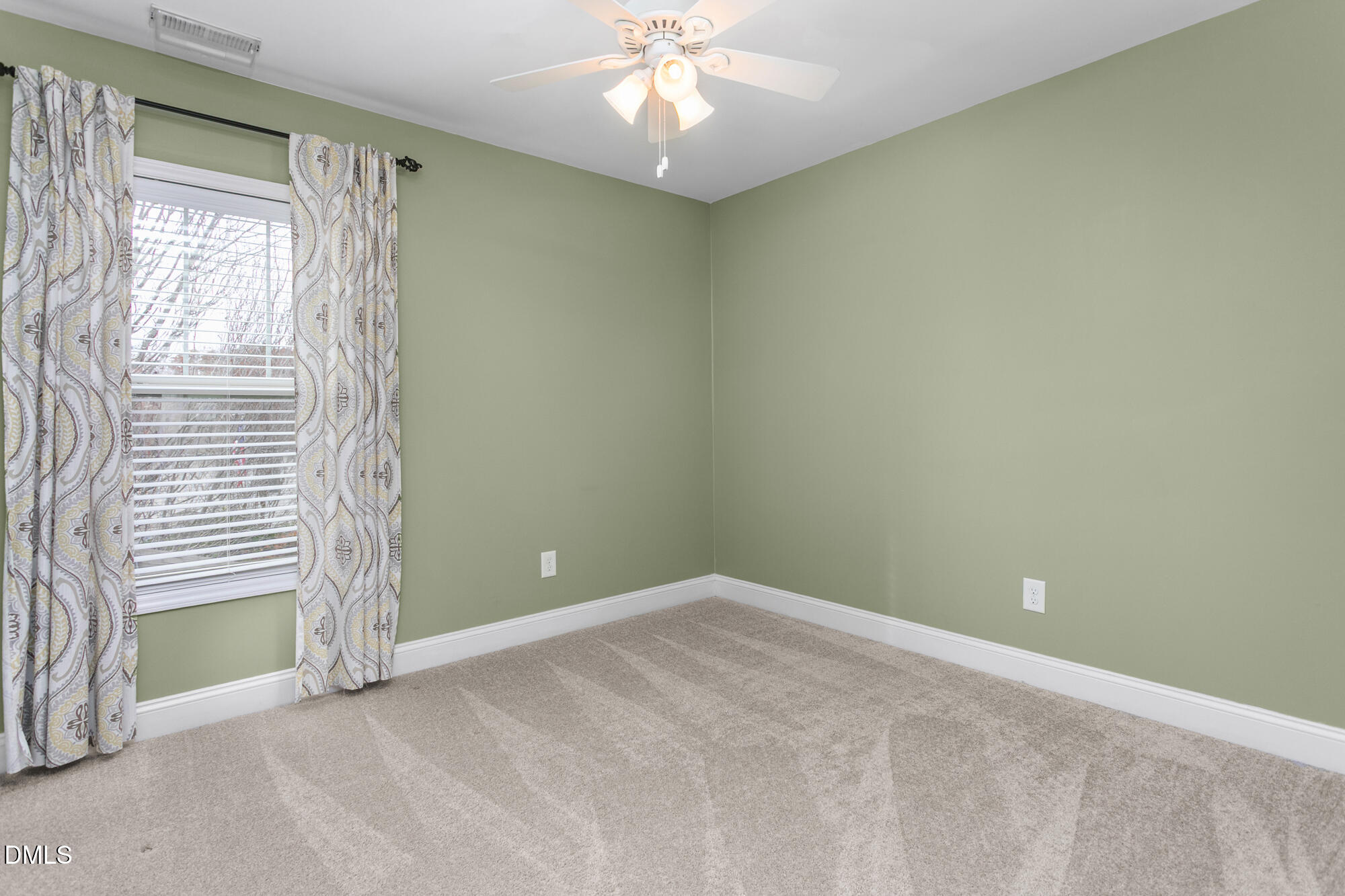 304 Green Pasture Road Mebane, NC 27302 - Photo 27 of 35 an empty room with windows and fan