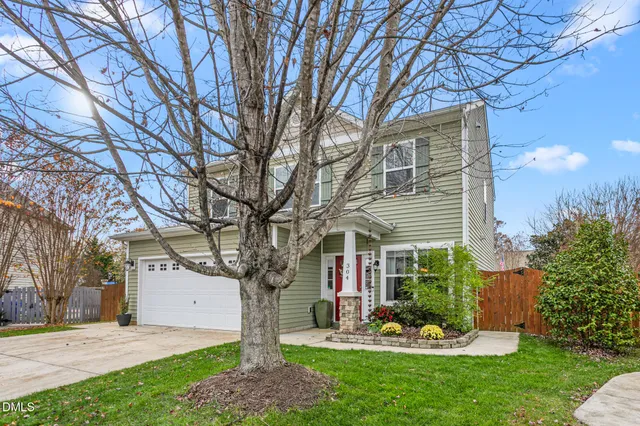 a front view of house with yard outdoor seating and green space