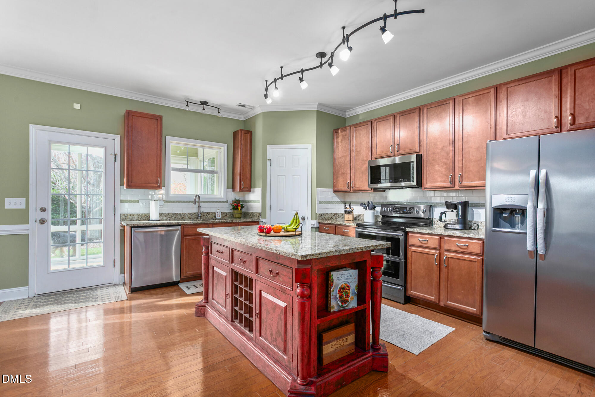 304 Green Pasture Road Mebane, NC 27302 - Photo 6 of 35 a kitchen with kitchen island granite countertop a stove refrigerator and a sink