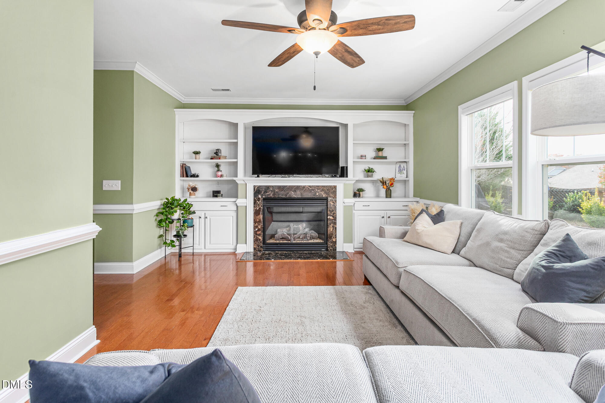 304 Green Pasture Road Mebane, NC 27302 - Photo 10 of 35 a living room with furniture a flat screen tv and a fireplace