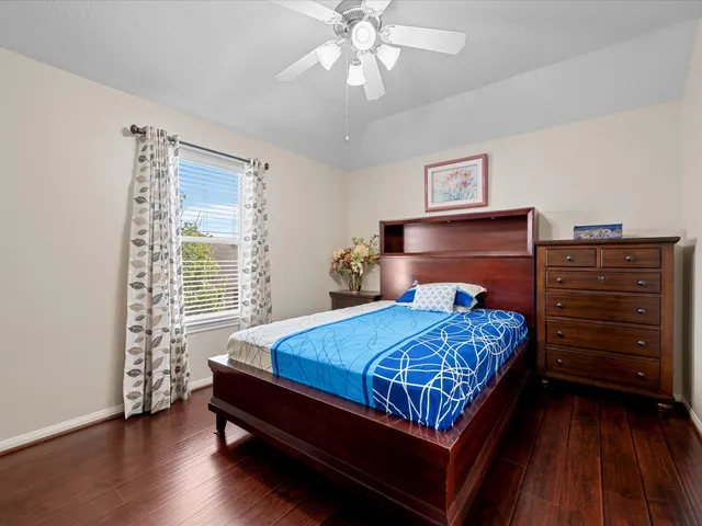 a bedroom with a bed and a dresser