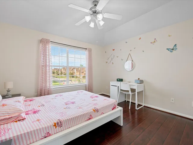 a bedroom with a bed and a table in it