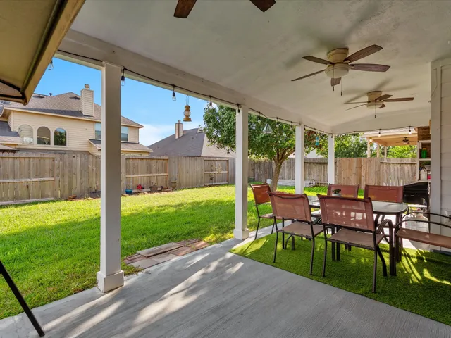 a view of an chairs and table in the patio