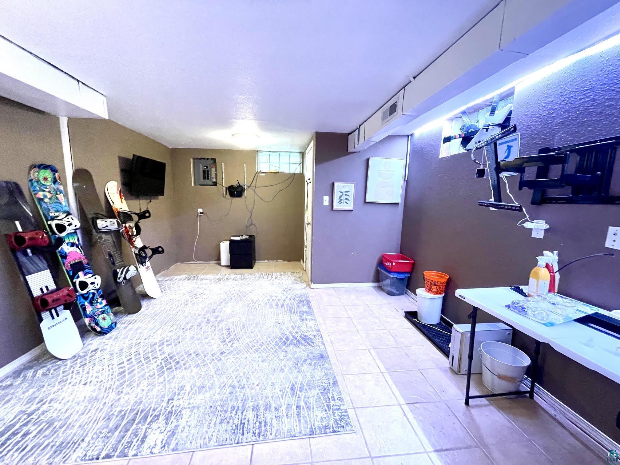 4804 Kroll Road Saginaw, MN 55779 - Photo 23 of 33 Lower level rec room tiled floor