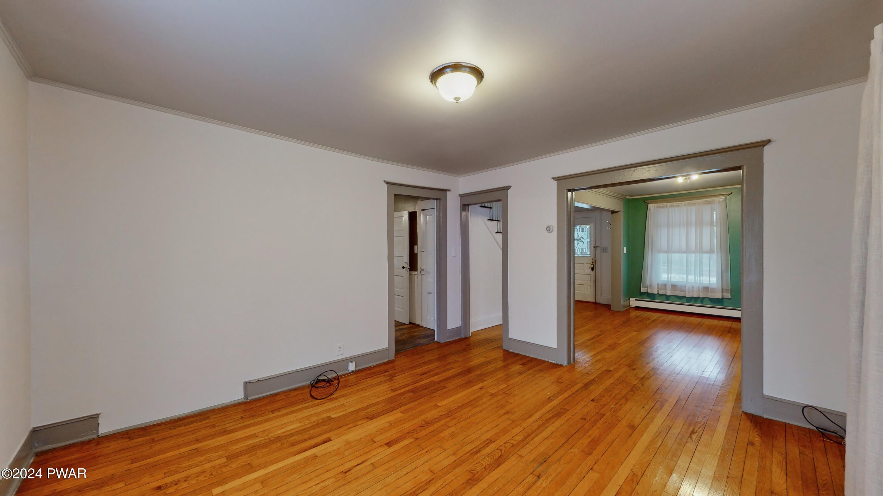 108 9th Street Milford, PA 18337 - Photo 7 of 38 wooden floor in an empty room with a window